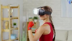 Woman Practicing Boxing Movements at Home Stock Footage