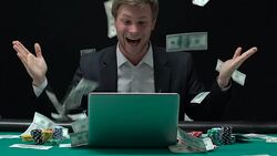 Happy man enjoying victory in rain of money, sports betting, online casino Stock Footage