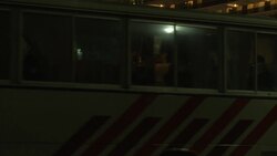 Australian embassy vehicle accompanies departing bus Instructional Video