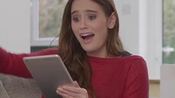 Happy woman holding tablet celebrating winning punching the air. Stock Footage