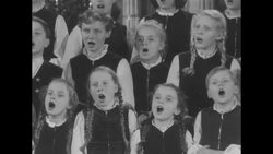 German children's choir singing "Silent Night" in church News Clip