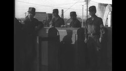 Soldiers load Korean orphans and their knapsacks onto train to take them to safety, May 1951 News Clip