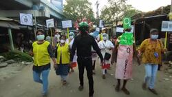 CLEAN : Activist in coronavirus mask urges Indians to protect themselves News Clip