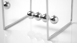 4k Newtons Cradle balancing balls, business concept in studio Stock Footage