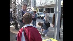 Checkpoint Charlie and souvenier seller in Berlin News Clip