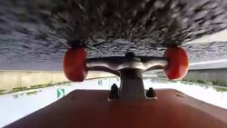 Under skateboard upside down POV - A person skating on a highway road Stock Footage