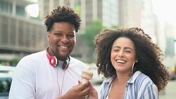 Couple Eating Ice Cream outdoors - Portrait Stock Footage
