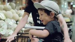 Asian mother and child shopping for groceries. Stock Footage