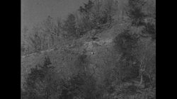 United States, c.1951: During a battle, two men run up a mountain before surrendering Stock Footage