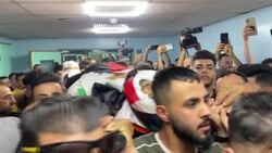 CLEAN : Mourners transport body of Palestinian killed by Israeli fire out of hospital News Clip