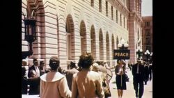 Man Carrying Peace Symbol Sign Stock Footage