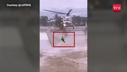 Firefighters rescue man who jumped into raging Los Angeles floodwaters to save his dog News Clip