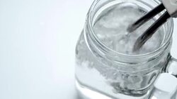 Boiling water with immersion heater Stock Footage