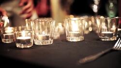 Restaurant staff setting outdoor table with candlelight on dinner table. Stock Footage