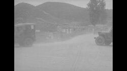 During Korean War, negotiators arriving at Panmunjom, North Korea, for first anniversary of peace talks News Clip