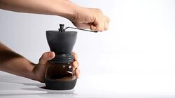 Hand rolling Coffee grinder to make Fresh coffee powder Stock Footage