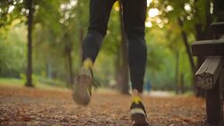 Man exercising / stretching in the park - nature. Stock Footage