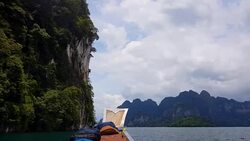 Moving follow boat with Beautiful mountains lake river sky and natural attractions in Ratchaprapha Dam at Khao Sok National Park, Surat Thani Province, Thailand. Stock Footage