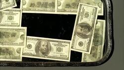 CLOSE ANGLE OF US ONE HUNDRED DOLLAR BILLS WITH BEN FRANKLIN'S IMAGE VISIBLE. 100 DOLLAR BILLS SEEM TAPED OR STUCK ONTO WINDOW OF DOOR. AMERICAN CURRENCY. Stock Footage