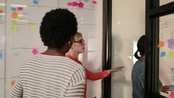 Coworkers arriving for a team meeting Stock Footage