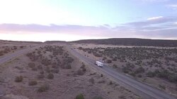 Aerial Drone Footage of Semi-Trucks Rolling Down the Highway Stock Footage