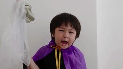 Thai boy with Halloween costume while acting and playing with Halloween skull and spear toy at home-Halloween concept Stock Footage