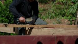 Builder hammering nail Stock Footage