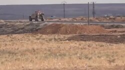 CLEAN : Syria: Russian and US armoured vehicles are seen near the town Ain Issa News Clip