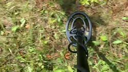 Metal Detector in Use on Grassy Meadow POV Stock Footage