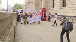 Children and their families holding placards at the protest over funding crisis in education for young people with special educational needs and disabilities News Clip