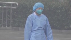 Staff decontaminate the outside of a Wuhan hospital News Clip
