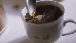 Steering fresh made cup of coffee Stock Footage