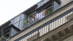 CLEAN : French dancer performs from Paris balcony News Clip