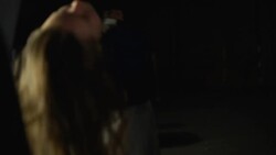 Kidnapper walking to car with tied female victim and putting woman into trunk Stock Footage