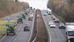 Farmers drive along the A303 during a national tractor rally organised by Farmers To Action News Clip
