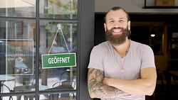 Young man running a German small business Stock Footage
