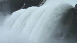 Slow motion of water dam drained from outlet pipe of the dam where is the hydropower electrical generation Stock Footage