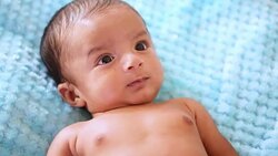 Newborn baby playing Stock Footage