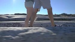 People walk among the coastal stones in Tjome nature Park, Norway Stock Footage