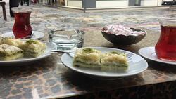 Plates full of with Turkish baklava with pistachio Stock Footage