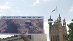 Protesters, who are former translators for the British Army, held banners and signs up in front of Parliament News Clip