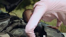 Man opened car hood and looking for a malfunction Stock Footage
