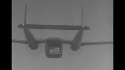 Fairchild C-119 Flying boxcars drop supplies via parachutes to UN troops during Korean War News Clip