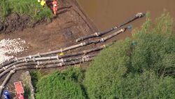 Aerial shots of the pump operation at Whaley Bridge dam News Clip