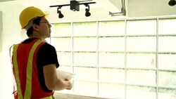 Engineer of the Project Holds blueprint and Discusses Project Details with management while They looking at construction site. Stock Footage