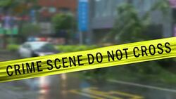Boundary Tape and Defocused Squad Car at Crime Scene Stock Footage