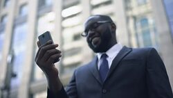 Business person satisfied with work of application in smartphone, online banking Stock Footage