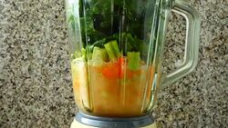 Cocktail from carrots, a stalk of a apium and spinacia. Process of preparation of cocktail. Stock Footage