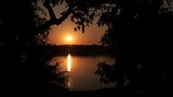 Sun setting over Zamezi River News Clip
