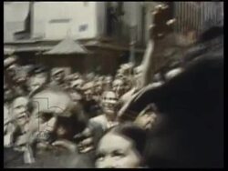 Crowd in Madrid cheer for Franco on balcony, CU of General Franco giving the fascist salute. Spain 1939 Stock Footage